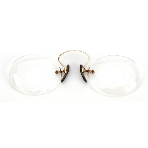 1237 - Pair of early 20th century spectacles with yellow metal mounts and case