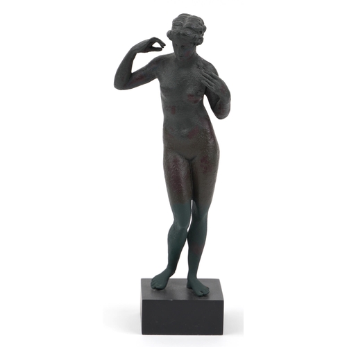 673 - Verdigris bronzed style statuette of Venus raised on a square ebonised base, 28.5cm high