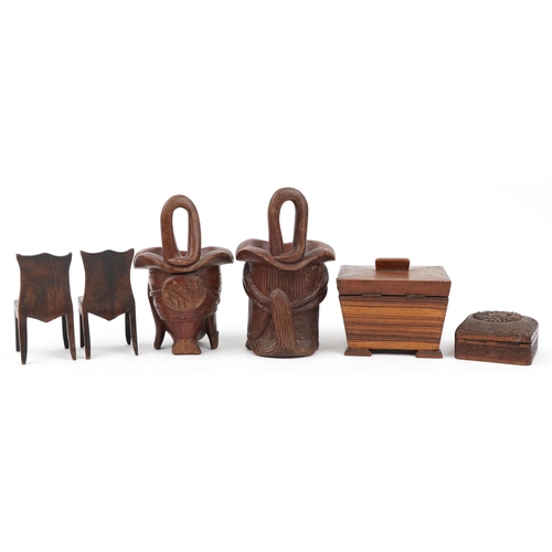 602 - Woodenware including a rosewood casket and a pair of Indian figural cups, the largest 24cm high