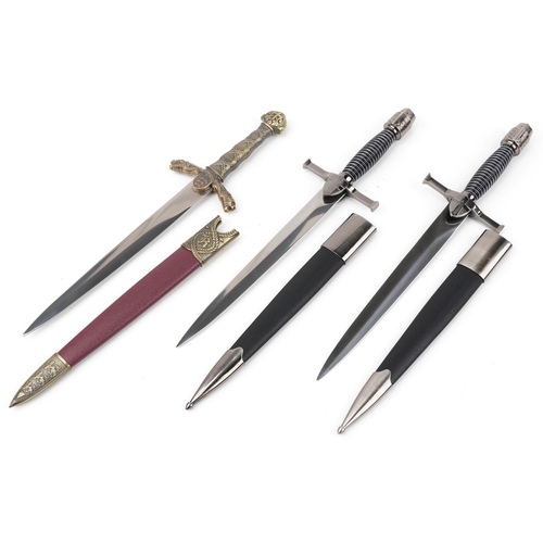 620 - Three decorative swords with scabbards and boxes, each 40cm in length