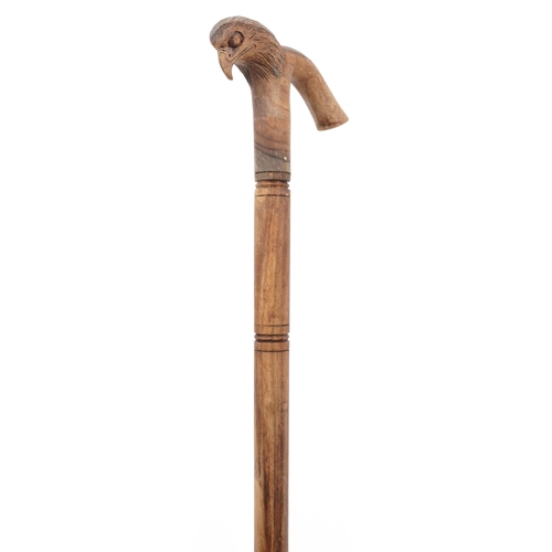 583 - Hardwood walking stick with carved bird design handle