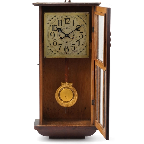 619 - Oak cased striking wall clock with silvered dial and Arabic numerals, 67cm high