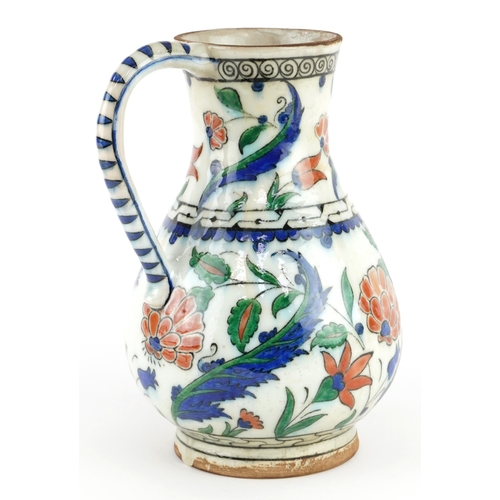 130 - Turkish Ottoman Iznik pottery water jug, 24cm high