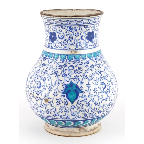 192 - Turkish Ottoman Iznik pottery vase hand painted with stylised flowers, 20.5cm high