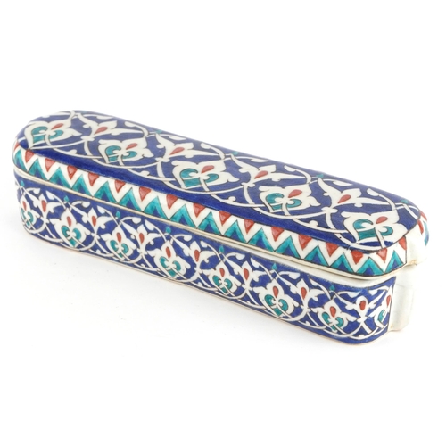 193 - Turkish Iznik pottery pen box and cover, 23.5cm in length