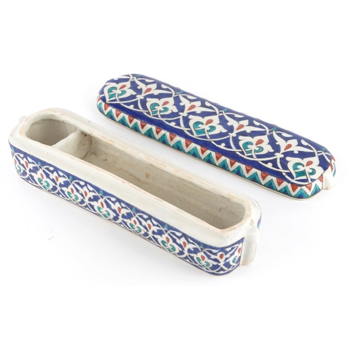 193 - Turkish Iznik pottery pen box and cover, 23.5cm in length