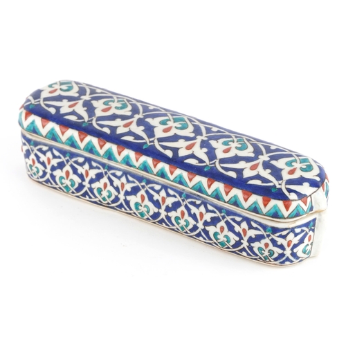 193 - Turkish Iznik pottery pen box and cover, 23.5cm in length