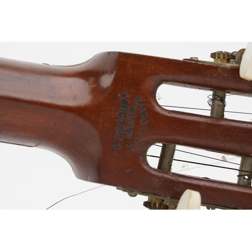 415 - T Bostock of London, 19th century mahogany and rosewood banjo, 93.5cm in length