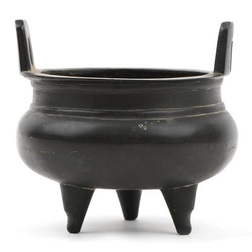 247 - Chinese patinated bronze tripod censer with twin handles, six figure character marks to the base, 12... 