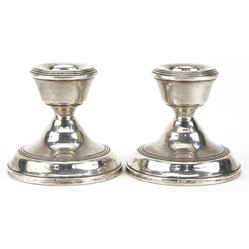 314 - Pair of circular silver dwarf candlesticks, Birmingham 1987, 7cm high, 307.0g