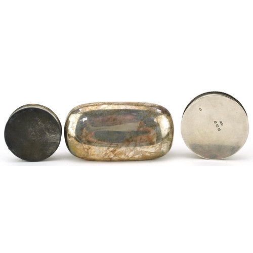 104 - Two circular silver pillboxes and a silver snuff box, the largest 6.5cm wide, total 58.2g