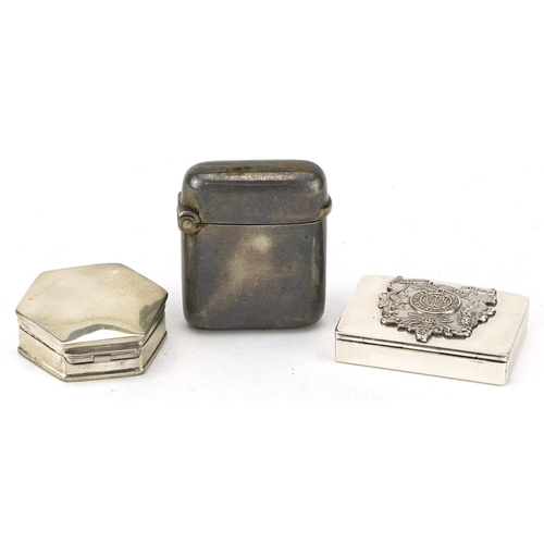 177 - Two silver pillboxes and a silver vesta including one relief decorated with British Royal coat of ar... 