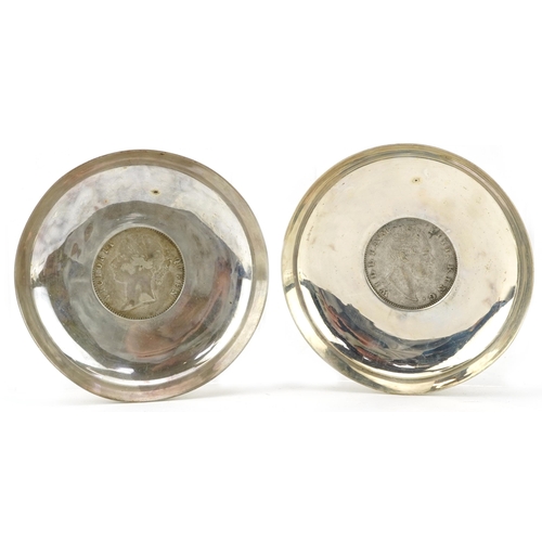 282 - Pair of Indian circular silver 1835 and 1840 one rupee coin dishes, 8cm in diameter, 77.8g