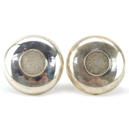 282 - Pair of Indian circular silver 1835 and 1840 one rupee coin dishes, 8cm in diameter, 77.8g