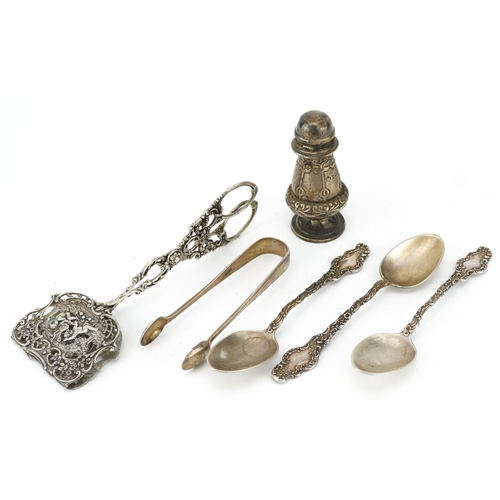 284 - Silver objects including a pair of Dutch 800 grade pastry tongs and a pair of sugar tongs, the large... 