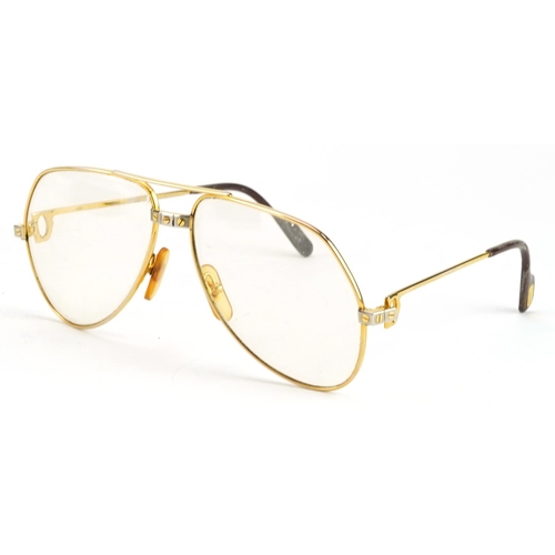 166 - Pair of vintage Must de Cartier spectacles with fitted case numbered 5914, 14.5cm wide