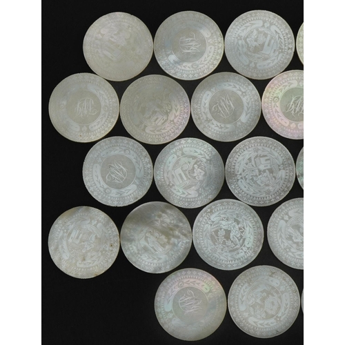 186 - Good collection of thirty Chinese Canton mother of pearl gaming counters carved with figures and flo... 