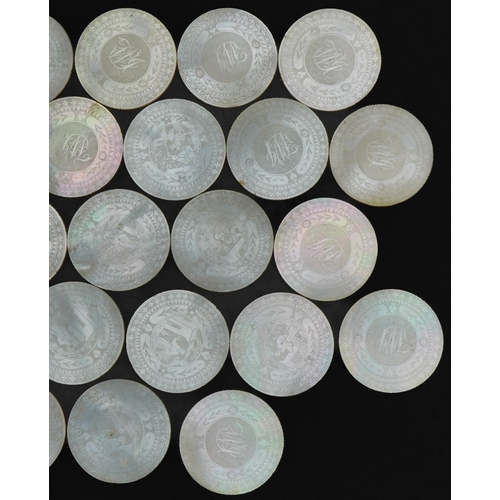 186 - Good collection of thirty Chinese Canton mother of pearl gaming counters carved with figures and flo... 