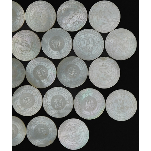 186 - Good collection of thirty Chinese Canton mother of pearl gaming counters carved with figures and flo... 