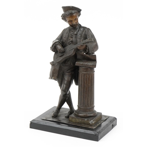 385 - Patinated spelter figure of a young musician leaning on a pillar raised on a rectangular ebonised bl... 