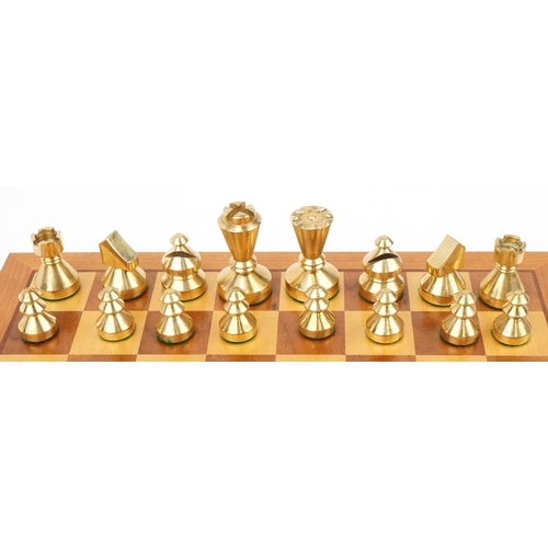 1428 - Modernist phosphorus bronze and brass chess set with inlaid chessboard, the largest pieces each 6cm ... 