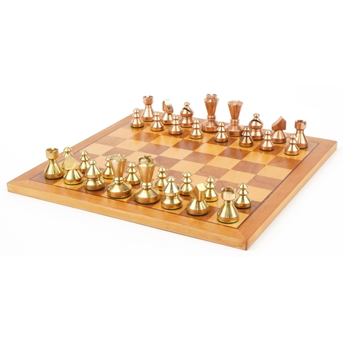 1428 - Modernist phosphorus bronze and brass chess set with inlaid chessboard, the largest pieces each 6cm ... 