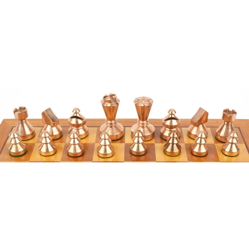 1428 - Modernist phosphorus bronze and brass chess set with inlaid chessboard, the largest pieces each 6cm ... 