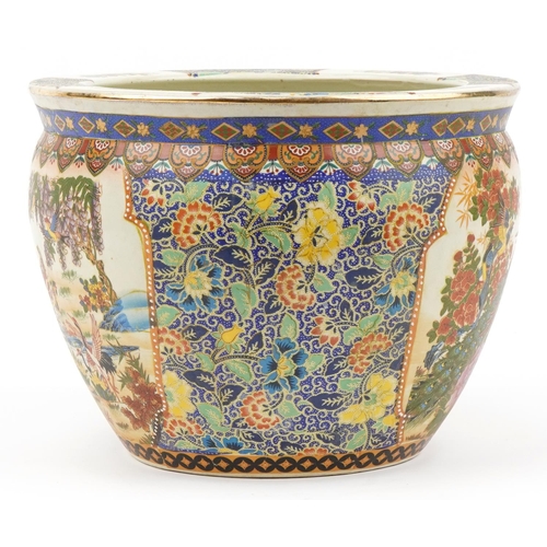 587 - Chinese porcelain jardiniere decorated with peacocks, flowers and fish, 28.5cm high x 37cm in diamet... 