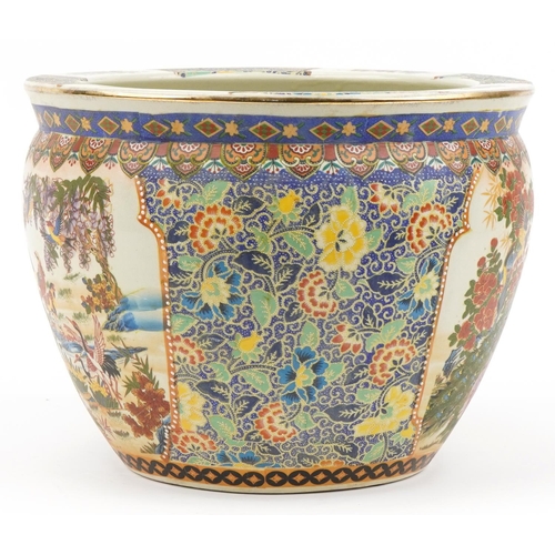 587 - Chinese porcelain jardiniere decorated with peacocks, flowers and fish, 28.5cm high x 37cm in diamet... 