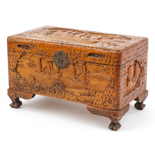 1034 - Chinese camphor wood table top chest carved with junks, 25cm H x 40cm W x 23cm D