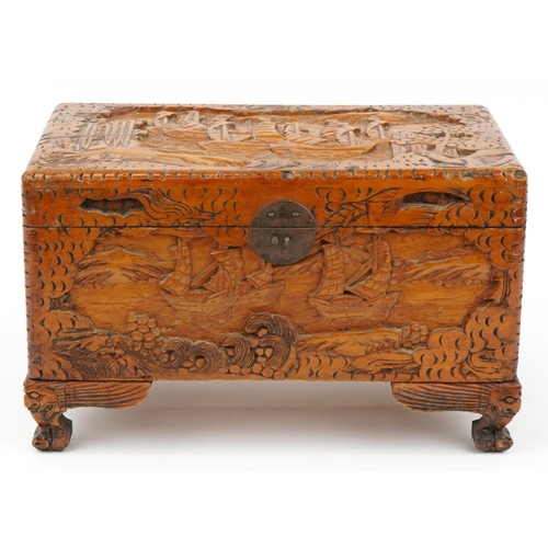 1034 - Chinese camphor wood table top chest carved with junks, 25cm H x 40cm W x 23cm D