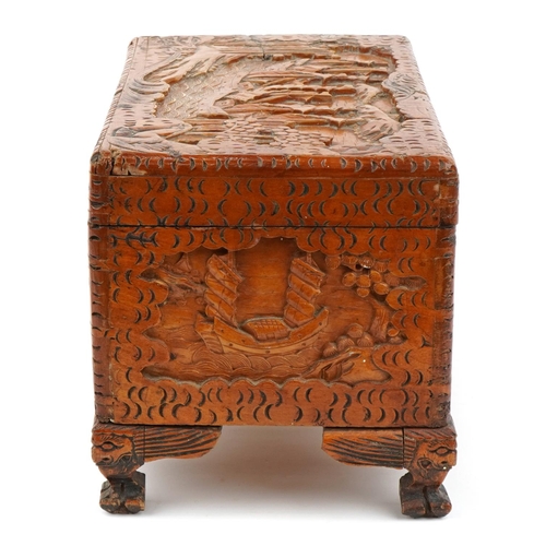 1034 - Chinese camphor wood table top chest carved with junks, 25cm H x 40cm W x 23cm D