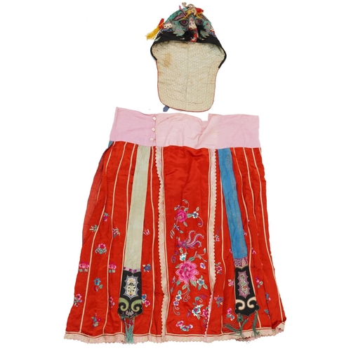 189 - Chinese Canton silk skirt embroidered with flowers and a silk hat embroidered with a toad, the large... 