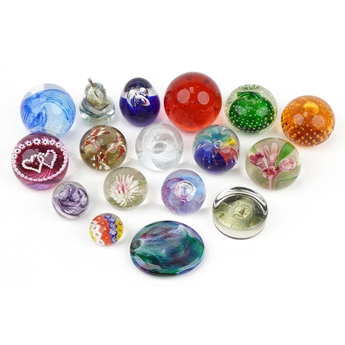 590 - Glass paperweights including millefiori, double love heart and Caithness examples, the largest 9.5cm... 