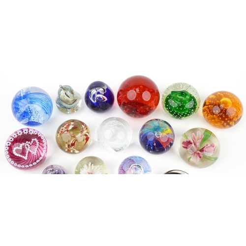 590 - Glass paperweights including millefiori, double love heart and Caithness examples, the largest 9.5cm... 