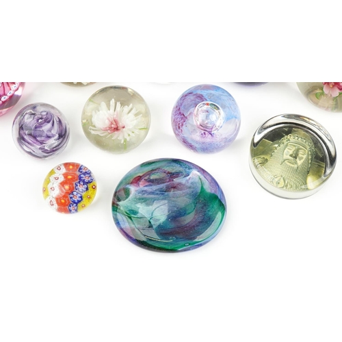 590 - Glass paperweights including millefiori, double love heart and Caithness examples, the largest 9.5cm... 