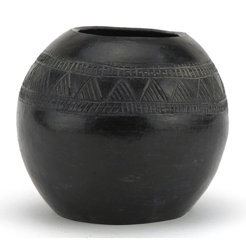 519 - Native American pottery vase incised with a geometric design, inscribed D Sibiya to the base, 12cm i... 