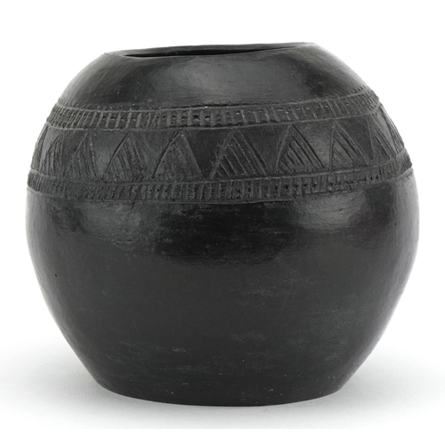 519 - Native American pottery vase incised with a geometric design, inscribed D Sibiya to the base, 12cm i... 