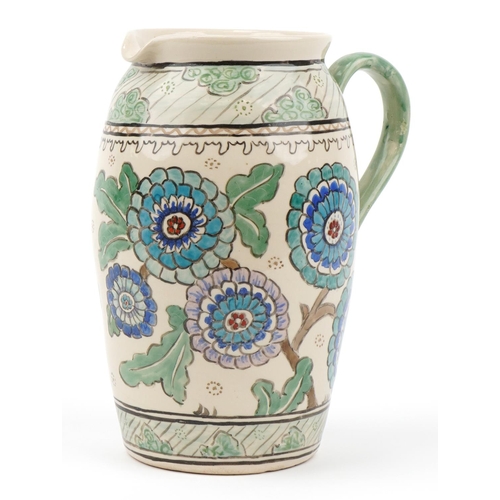 595 - Manner of Charlotte Rhead, large Highwoods  pottery jug hand painted with flowers, 30cm high