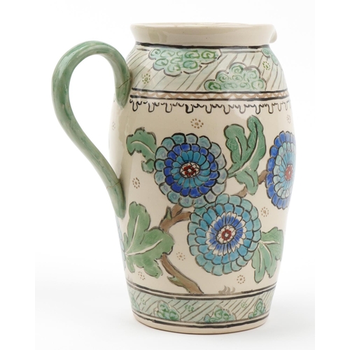 595 - Manner of Charlotte Rhead, large Highwoods  pottery jug hand painted with flowers, 30cm high