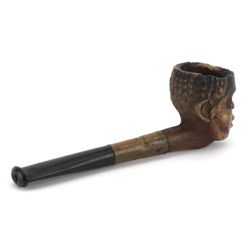 266 - Novelty terracotta smoking pipe with ebonised mouthpiece in the form of a blackamoor, 9cm in length