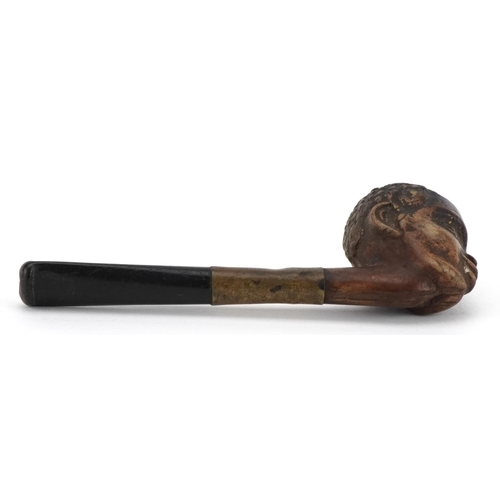 266 - Novelty terracotta smoking pipe with ebonised mouthpiece in the form of a blackamoor, 9cm in length