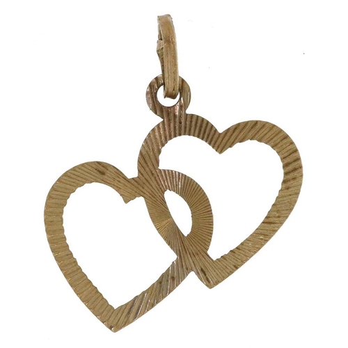 2220 - 9ct gold double love heart pendant with engine turned decoration, 2.7cm high, 1.0g