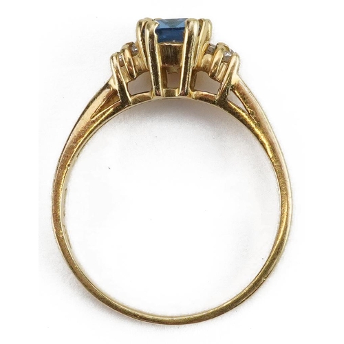 2040 - 18ct gold blue topaz and clear stone ring, the blue topaz approximately 7.1mm x 4.9mm, size Q, 4.2g