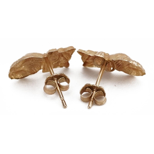 2127 - Pair of unmarked gold seated cat stud earrings, the butterflies marked 9k, 1.2cm high, 0.3g