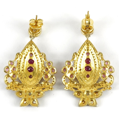 2324 - Pair of large Indian silver gilt diamond drop earrings set with rubies and garnets, 5cm high, 23.0g