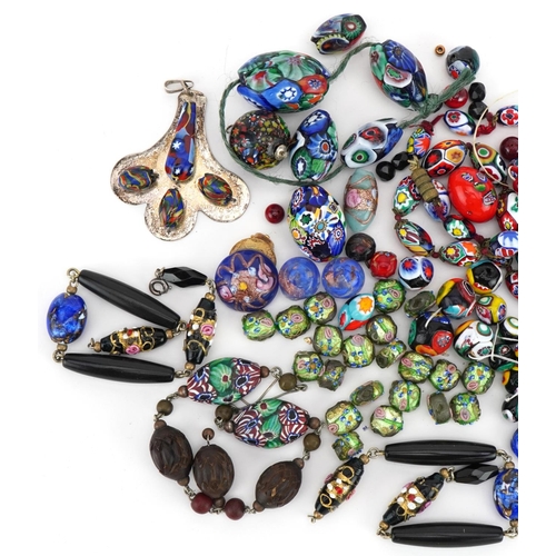 2284 - Collection of Venetian millefiori glass beads and pendants, the largest bead approximately 4.3cm hig... 