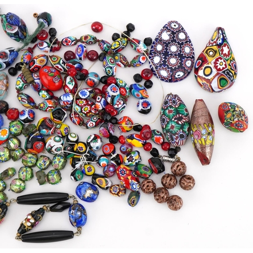 2284 - Collection of Venetian millefiori glass beads and pendants, the largest bead approximately 4.3cm hig... 