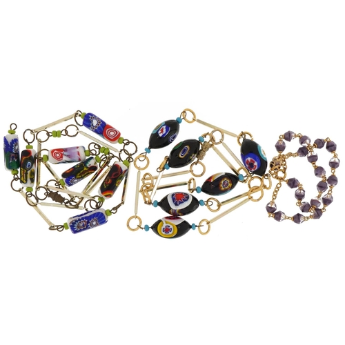 2300 - Two Venetian glass millefiori bead necklaces and a purple glass bead choker with yellow metal clasp