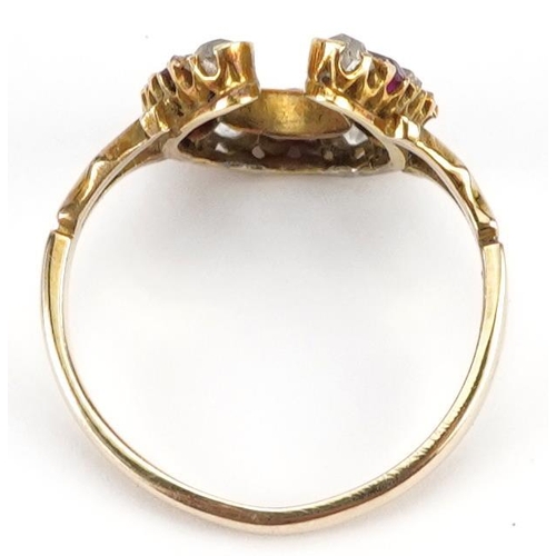 2307 - 19th century unmarked gold diamond and ruby horseshoe ring, tests as 18ct gold, the largest diamond ... 